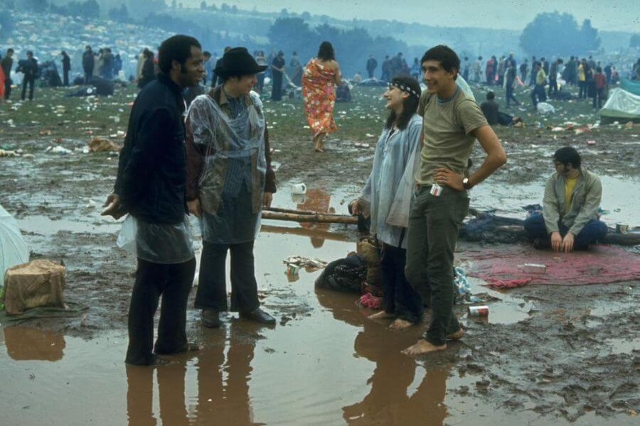 group of young people covered in mud