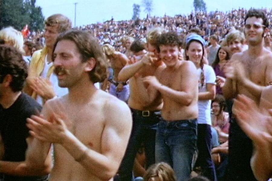 shirtless young man clapping