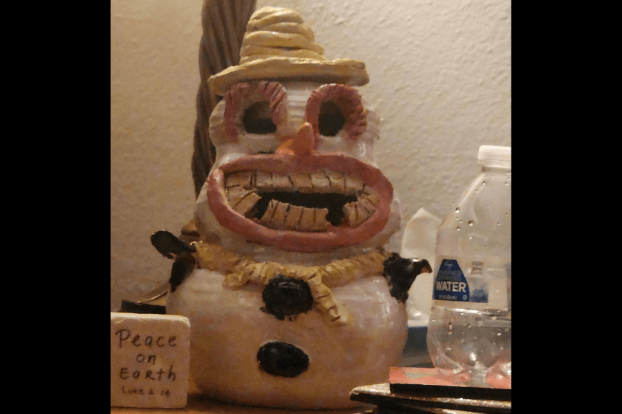 creepy face snowman figure