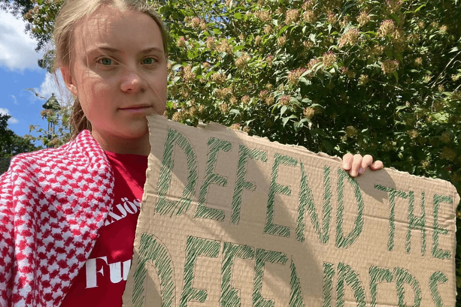 teen protesting for climate change initiatives