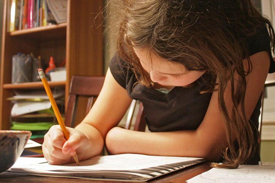 young girl doing homework