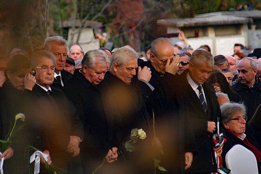 serious people at a funeral