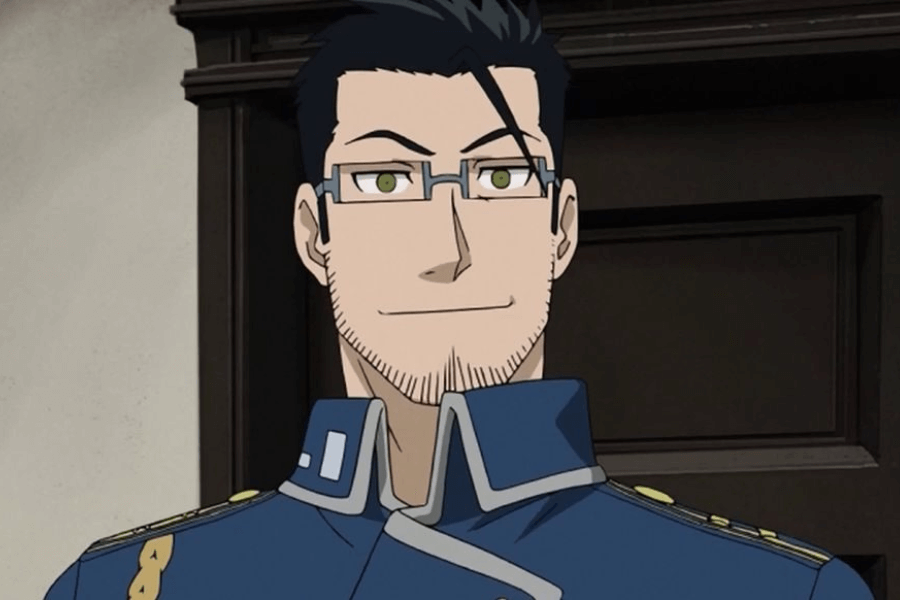 This image shows an animated character with a confident expression, wearing glasses and a neatly groomed beard. He is dressed in a formal blue military-style uniform adorned with gold details and standing in front of a dark wooden door. His demeanor suggests authority and professionalism, complemented by his calm smile.
