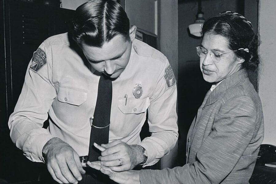 Rosa Parks being fingerprinted by Deputy Sheriff D.H. Lackey after being arrested on February 22, 1956, during the Montgomery bus boycott