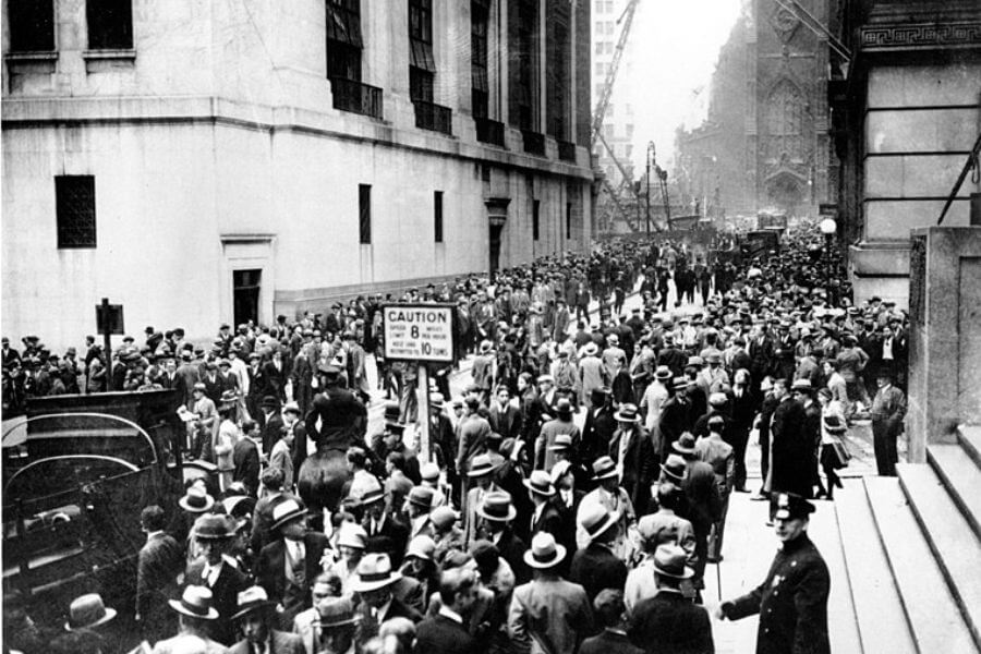 Crowds panic in the Wall Street district of Manhattan due to the heavy trading on the stock market in New York City on Oct. 24, 1929.