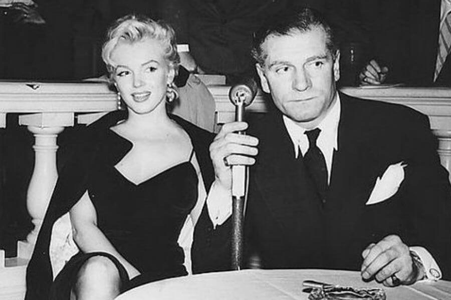 Photo of Marilyn Monroe and Sir Laurence Olivier. The photo was sent out to publicize the fact that they would be making a film together. The film had a working title of The Sleeping Prince, but was called The Prince and the Showgirl when it was released.