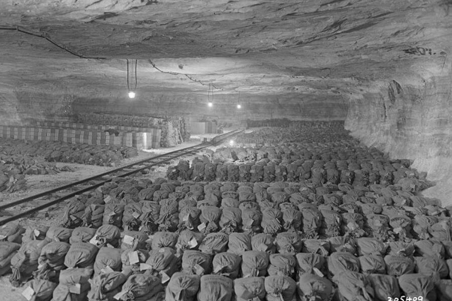 : "Germany. The 90th Infantry Division (United States), discovered this Reichsbank wealth, SS loot, and Berlin museum paintings that were removed from Berlin to a salt mine vault in Merkers, Germany