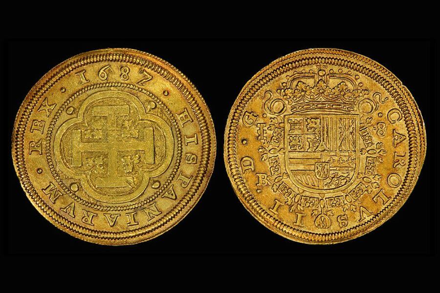 close up to two spanish gold coins from 1687