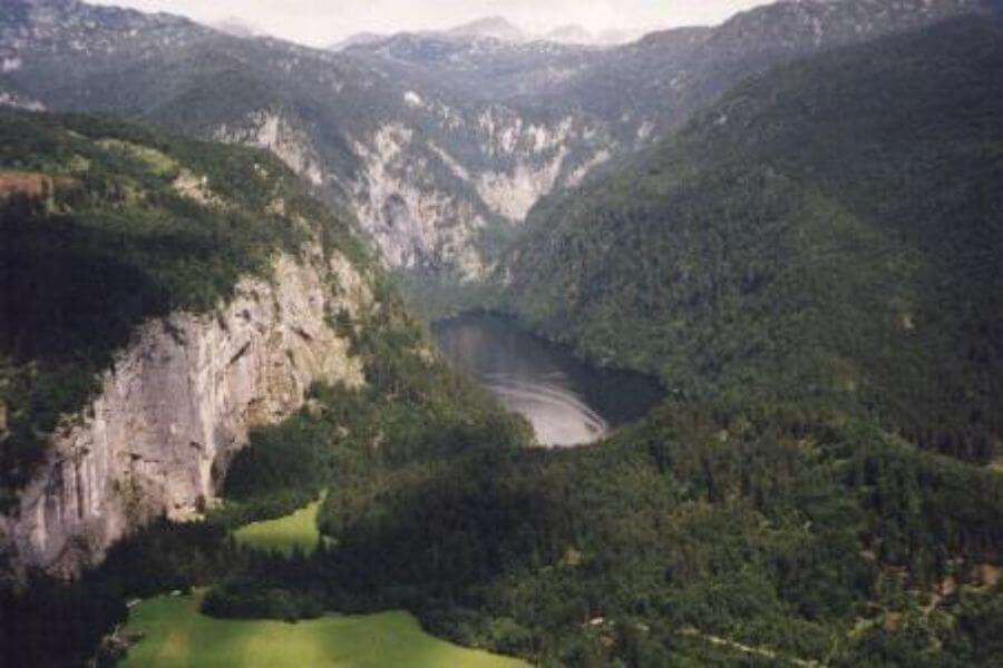 Aerial view of a lake in the middle of a forest