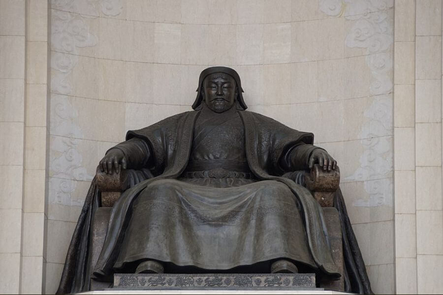 bronze statue of Genghis Khan sitting on a throne