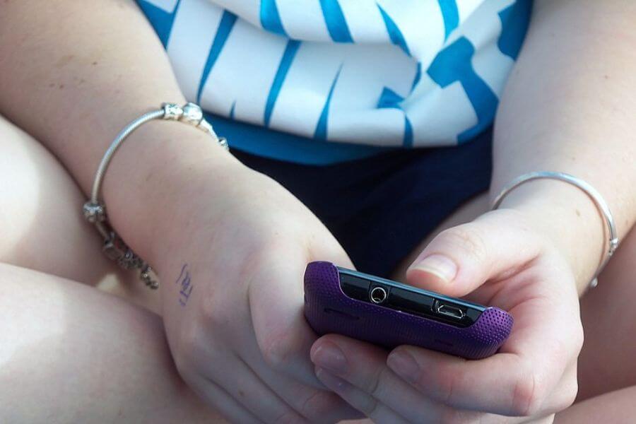 Teen girl texting close-up