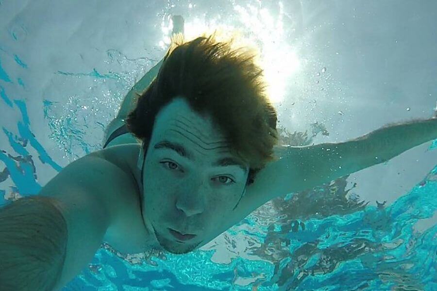 Young man Diving underwater 