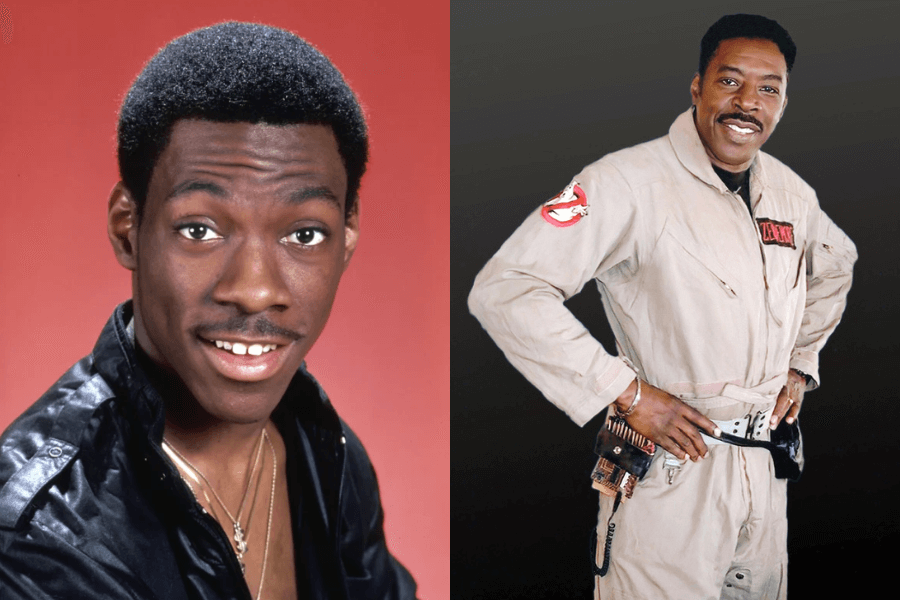 A side-by-side image featuring two actors known for their charisma. On the left, a young man with short hair and a mustache wears a black leather jacket and gold chains, smiling against a red backdrop. On the right, a man dressed in the classic beige Ghostbusters uniform, complete with a utility belt and ghost-catching equipment, poses confidently with a smile.