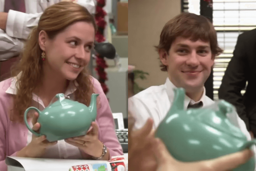 A split-screen image shows a woman in a pink sweater and a man in a white shirt, both smiling warmly while holding the same green teapot. The woman looks delighted as she admires the gift, while the man has a satisfied, affectionate expression as he watches her reaction. The setting appears to be an office during a holiday gift exchange, adding to the sentimental moment.