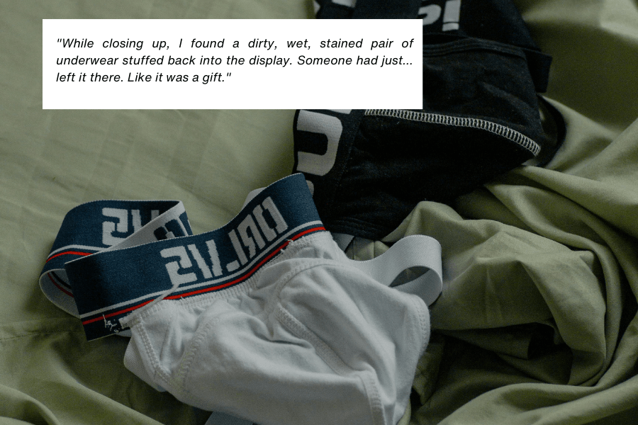 This image shows a pair of white and black underwear with branded elastic waistbands lying on a green fabric surface, appearing discarded. The quote in the image reads: "While closing up, I found a dirty, wet, stained pair of underwear stuffed back into the display. Someone had just... left it there. Like it was a gift."