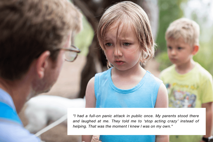 A young child wearing a blue tank top looks upset and distressed while standing outdoors. An adult leans toward them, partially visible in the foreground, and another child stands in the background, slightly out of focus. Below the image, text reads: "I had a full-on panic attack in public once. My parents stood there and laughed at me. They told me to ‘stop acting crazy’ instead of helping. That was the moment I knew I was on my own."