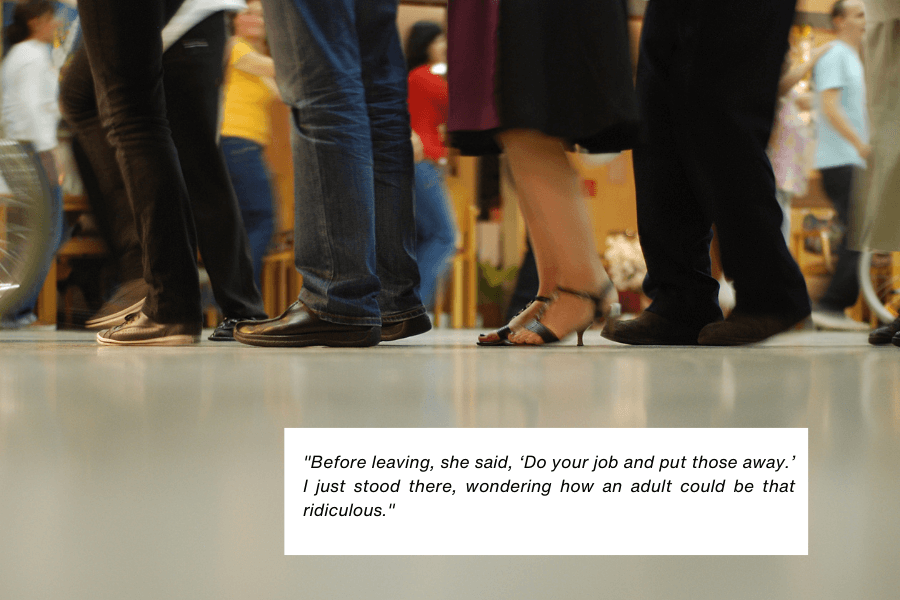 This image shows a close-up of people’s feet and lower legs in a public indoor space, with individuals wearing various shoes, including high heels and casual footwear. The background is slightly blurred, indicating a bustling environment. A quote in the image reads: "Before leaving, she said, ‘Do your job and put those away.’ I just stood there, wondering how an adult could be that ridiculous."