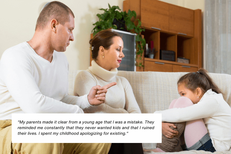 A young girl sits on a couch, curled up with her arms around her knees, looking upset. Across from her, two adults, a man pointing and a woman watching intently, appear to be addressing her sternly. The setting is a living room with warm lighting and furniture in the background. Below the image, text reads: "My parents made it clear from a young age that I was a mistake. They reminded me constantly that they never wanted kids and that I ruined their lives. I spent my childhood apologizing for existing."