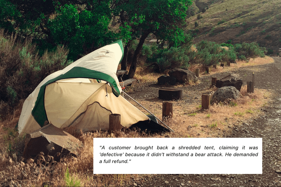 This image shows a camping tent that has been badly shredded, set in a rustic outdoor area with trees, rocky terrain, and wooden posts visible in the background. The quote in the image reads: "A customer brought back a shredded tent, claiming it was 'defective' because it didn't withstand a bear attack. He demanded a full refund."