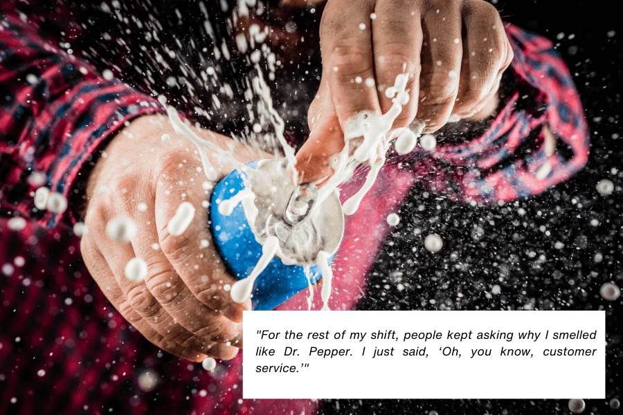 This image shows a close-up of someone opening a can of soda, causing a dramatic spray of liquid to splash outward. The person is wearing a red plaid shirt, and the action captures the moment of the spill. A quote in the image reads: "For the rest of my shift, people kept asking why I smelled like Dr. Pepper. I just said, ‘Oh, you know, customer service.’"