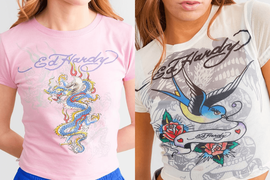 Two women wearing classic Ed Hardy graphic T-shirts, featuring bold tattoo-inspired designs. The left shirt is pink with a colorful dragon print and the Ed Hardy logo, while the right shirt is white and semi-sheer, featuring a blue swallow, roses, and a skull in the background. The shirts embody the iconic Y2K aesthetic with their signature edgy, intricate artwork.