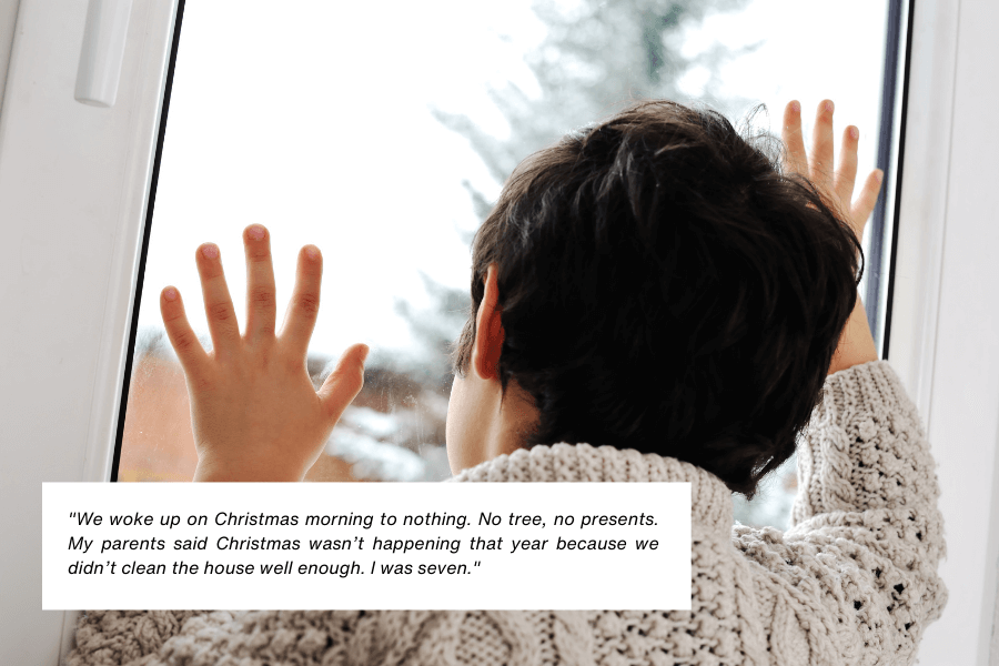 A child wearing a knit sweater presses their hands and face against a window, gazing outside at a snowy landscape. Their posture suggests longing or sadness. Below the image, text reads: "We woke up on Christmas morning to nothing. No tree, no presents. My parents said Christmas wasn’t happening that year because we didn’t clean the house well enough. I was seven."