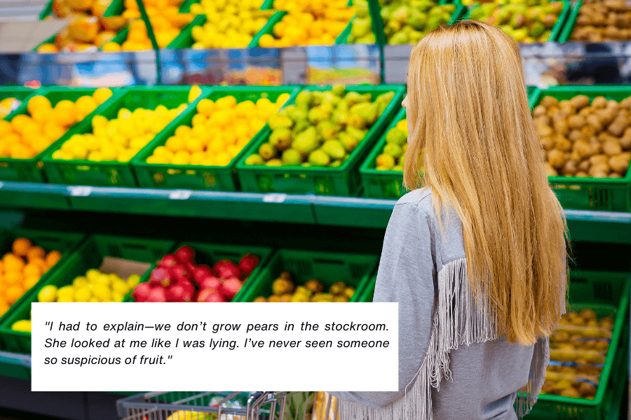 This image shows a woman with long blonde hair standing in front of a produce section in a grocery store, looking at colorful fruits neatly arranged in green crates. The quote in the image reads: "I had to explain—we don’t grow pears in the stockroom. She looked at me like I was lying. I’ve never seen someone so suspicious of fruit."