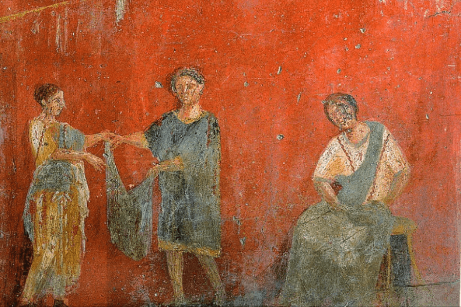 An ancient Roman fresco depicting three figures against a vibrant red background. Two individuals, a man and a woman, appear to be engaged in a transaction or exchange of fabric, while a seated woman observes. The artwork, worn and faded in some areas, showcases classical Roman attire and artistic style, likely originating from Pompeii or Herculaneum.