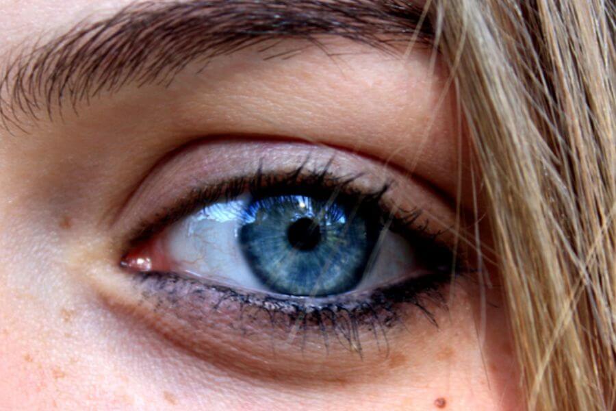 close up of a bright blue female eye