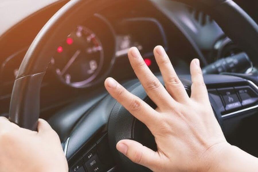 Hand honking on a car