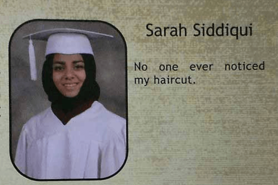 A high school graduation yearbook photo of Sarah Siddiqui, wearing a white cap and gown along with a black hijab. She is smiling at the camera. Her humorous yearbook quote reads, "No one ever noticed my haircut," playfully referencing the fact that her hair is always covered.