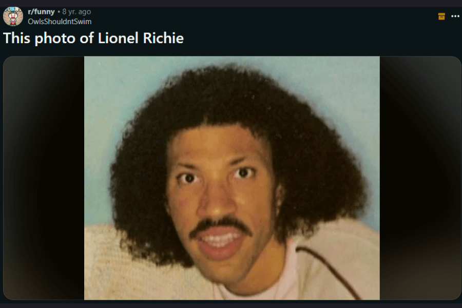 A distorted, low-quality image of a man with a thick mustache and a full, curly afro hairstyle, resembling Lionel Richie. The image appears to be a humorous edit or a poorly scanned photograph, with exaggerated facial features and an awkward expression. The meme caption above reads, "This photo of Lionel Richie," adding to the comedic effect.