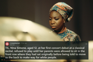 Nina Simone looks down thoughtfully, wearing a patterned headscarf and a matching dress. Her expression is serious and contemplative, with soft lighting emphasizing her features. Overlaid on the image is a Reddit post from r/todayilearned that reads, "TIL, Nina Simone, aged 12, at her first concert debut at a classical recital, refused to play until her parents were allowed to sit in the front row where they had sat originally before being told to move to the back to make way for white people."