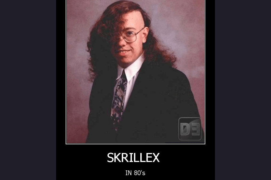 A vintage yearbook-style portrait of a young man wearing a suit and tie, sporting an asymmetrical hairstyle with one side shaved and the other side featuring long, curly hair. He also wears glasses and has a friendly smile. The meme text below humorously labels the image as "SKRILLEX IN 80’s," playing on the resemblance to the modern electronic music artist’s signature undercut hairstyle.