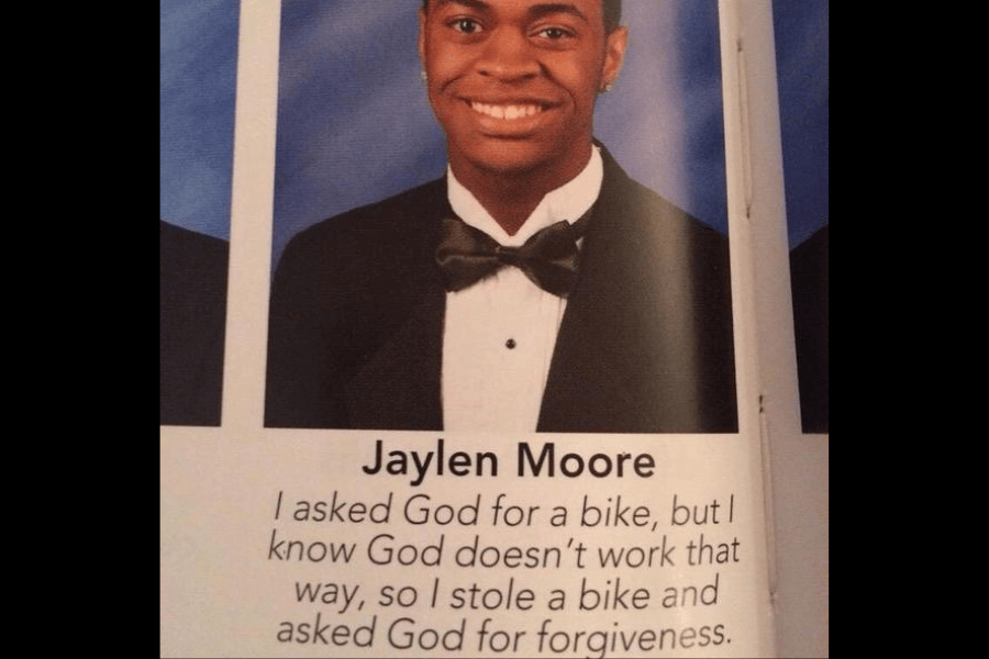 A high school yearbook photo of Jaylen Moore, a young man wearing a black tuxedo and bow tie, smiling at the camera against a blue backdrop. Below his name, his humorous yearbook quote reads, "I asked God for a bike, but I know God doesn’t work that way, so I stole a bike and asked God for forgiveness," playing on the concept of divine intervention in a comedic way.