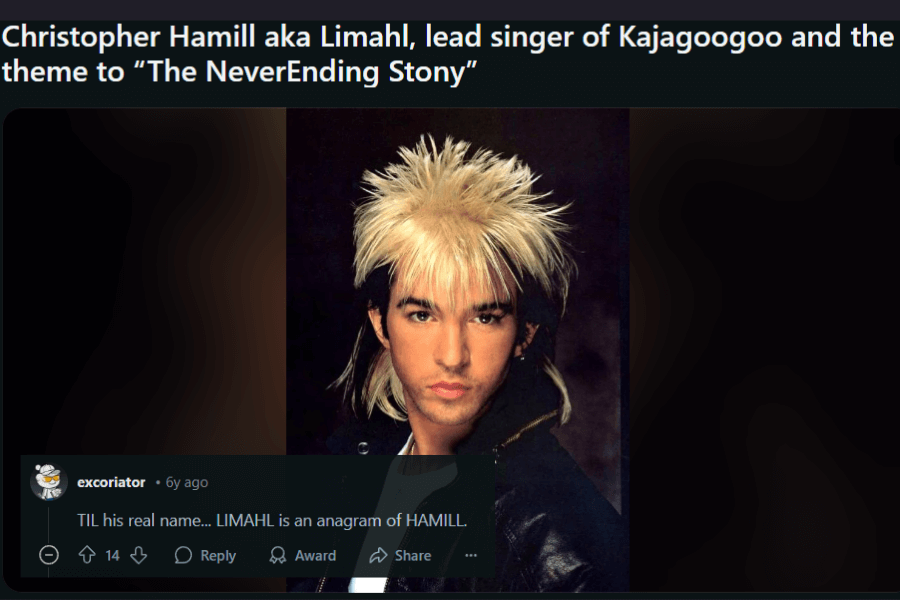 A dramatic portrait of Limahl, the lead singer of Kajagoogoo, known for his signature spiky two-tone blonde and black mullet. He wears a high-collared black jacket and gazes intensely at the camera, embodying peak 80s new wave fashion. The text above highlights his contributions to music, including The NeverEnding Story theme, while a comment below reveals that "Limahl" is an anagram of his real last name, "Hamill."