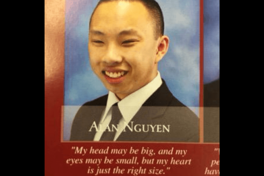 A high school yearbook photo of Alan Nguyen, a young man wearing a black suit, white shirt, and a tie, smiling at the camera against a blue backdrop. Below his name, his humorous yearbook quote reads, "My head may be big, and my eyes may be small, but my heart is just the right size," making a lighthearted self-deprecating joke.