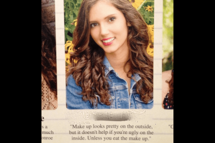 A high school yearbook photo of a young woman with long, curly brown hair, smiling at the camera while wearing a denim jacket. The background features greenery and yellow flowers. Below her name, her humorous yearbook quote reads, "Makeup looks pretty on the outside, but it doesn’t help if you’re ugly on the inside. Unless you eat the makeup."