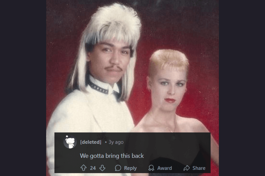 A vintage portrait of a stylish couple featuring bold 1980s hairstyles. The man sports a striking two-tone mullet with platinum blonde on top and dark hair underneath, along with a thin mustache and a white high-collared outfit with studded details. The woman has a sleek, closely cropped blonde hairstyle and wears a strapless black dress with bold red lipstick. A comment below humorously suggests that this iconic look should make a comeback.