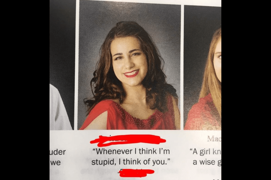 A high school yearbook photo of a young woman with shoulder-length curly brown hair, wearing a red dress and smiling at the camera. Below her redacted name, her humorous and slightly sarcastic yearbook quote reads, "Whenever I think I’m stupid, I think of you."