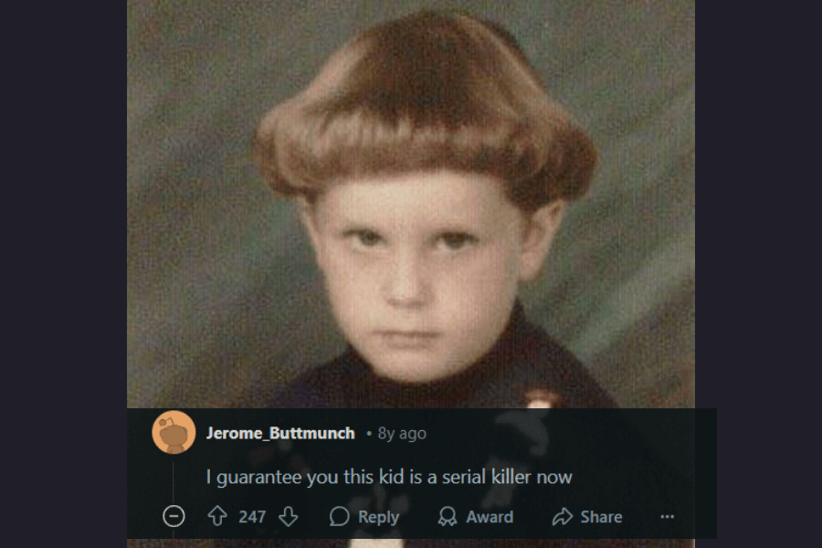 A vintage school portrait of a young child with a perfectly sculpted bowl cut featuring high-volume, rounded sides. The child has a serious, almost menacing expression, staring directly into the camera. The image has a grainy, slightly faded quality, reminiscent of old-school photography. A humorous comment below jokingly suggests that the intense expression and haircut combination might predict a dark future.