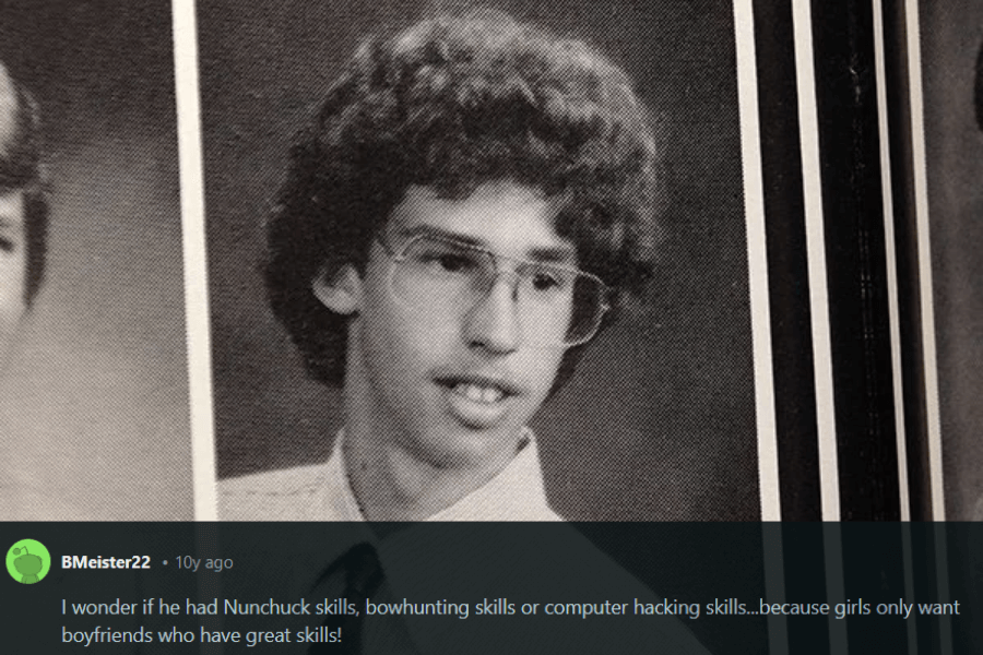 A black-and-white yearbook photo of a young man with curly hair, large glasses, and a collared shirt paired with a dark tie. He has an awkward but endearing expression, reminiscent of classic nerdy high school portraits. Below the image, a humorous comment references the movie Napoleon Dynamite, joking about "nunchuck skills, bowhunting skills, or computer hacking skills."