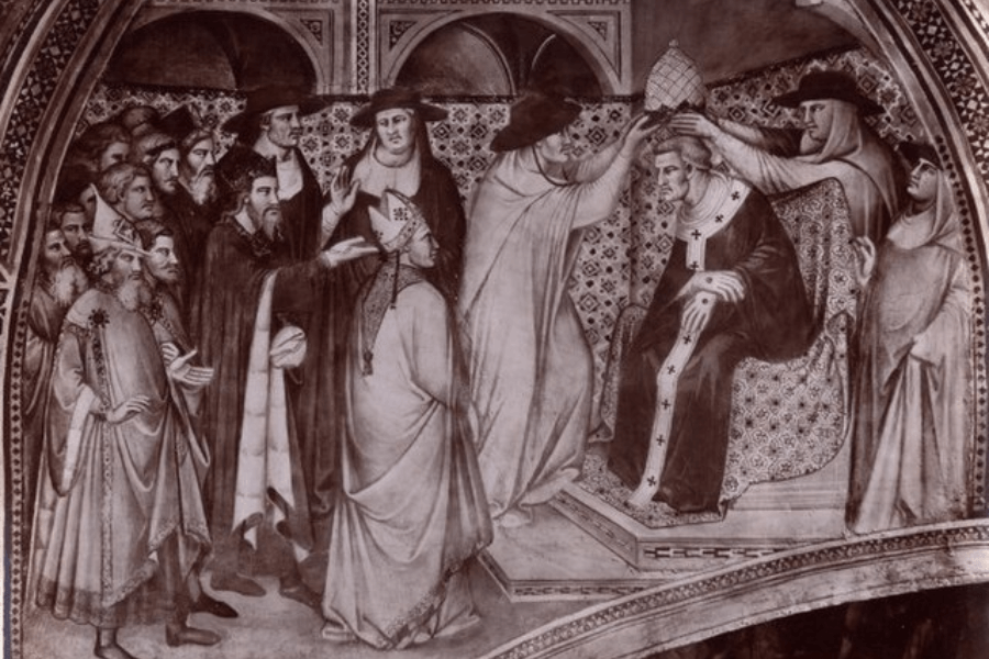 Sepia-toned fresco depicting a medieval papal coronation, with a pope seated on a richly decorated throne receiving the papal tiara from church officials. Surrounding him are bishops and clergy, some gesturing or holding liturgical items, all dressed in traditional ecclesiastical robes.