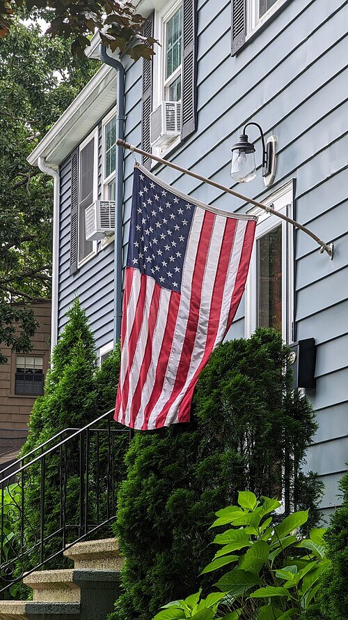 American flag on a house porch