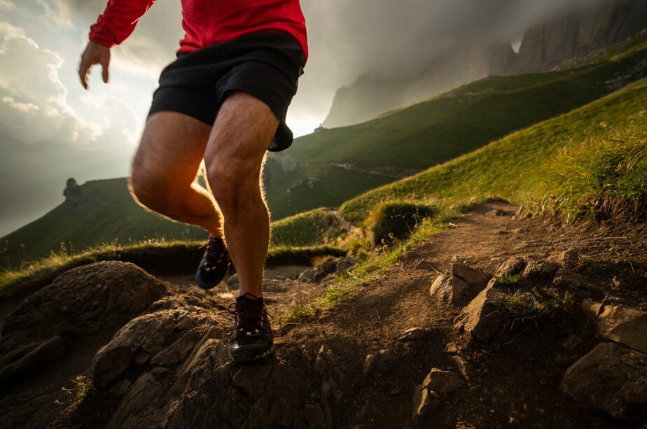 Man trail running on Dolomites high mountain