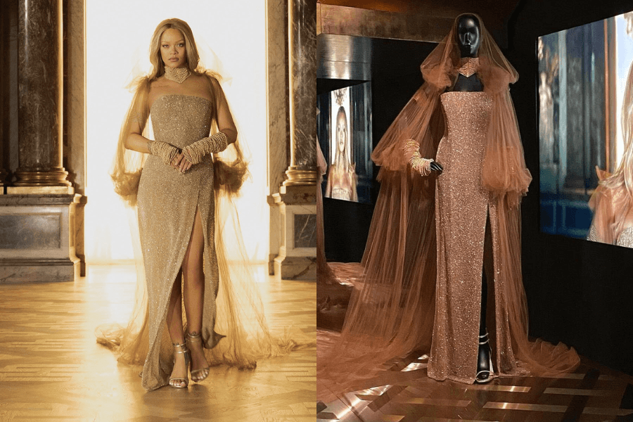 Side-by-side images showcasing Rihanna in a shimmering gold gown next to its exhibition display. On the left, Rihanna poses regally in the sparkling strapless dress with a thigh-high slit, sheer golden gloves, a matching tulle cape, and choker, all glowing under warm light in a grand hall. On the right, the same gown is shown on a mannequin at a fashion exhibit, complete with the cape, gloves, and jewelry, set against digital screens displaying Rihanna in the ensemble.