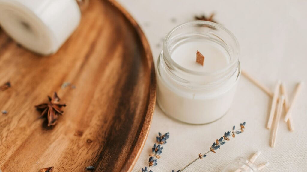 Close-up of a white candle inside a jar