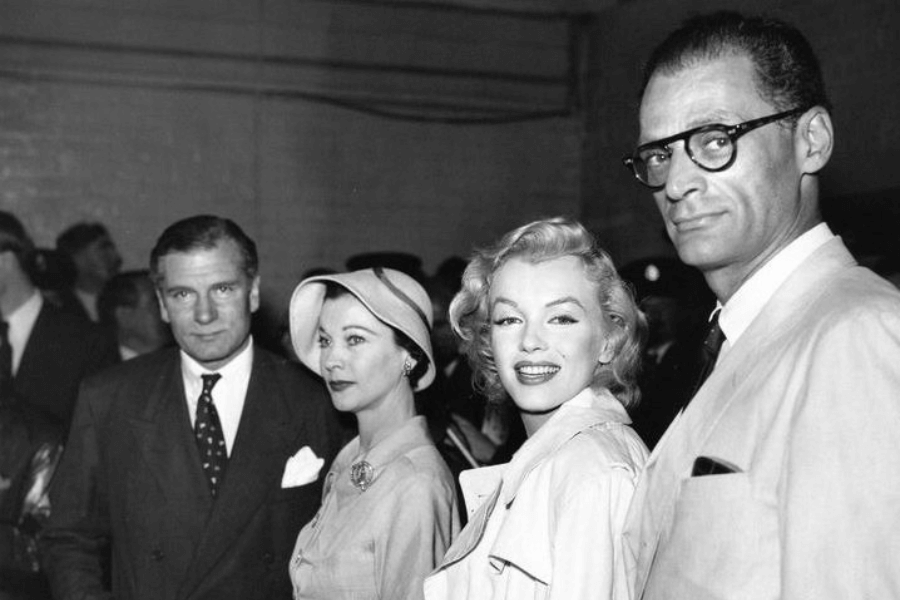 Laurence Olivier, Vivien Leigh, Marilyn Monroe, and Arthur Miller at the London Airport prior to filming The Prince and the Showgirl