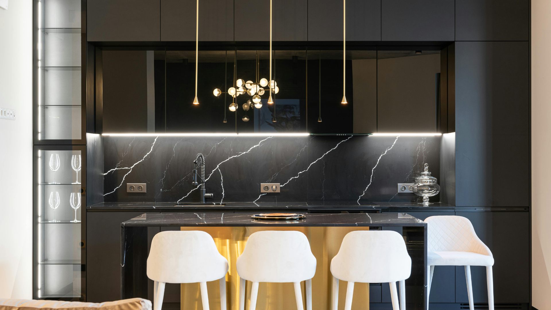 Modern black and wood kitchen with counter seating and clean cabinetry