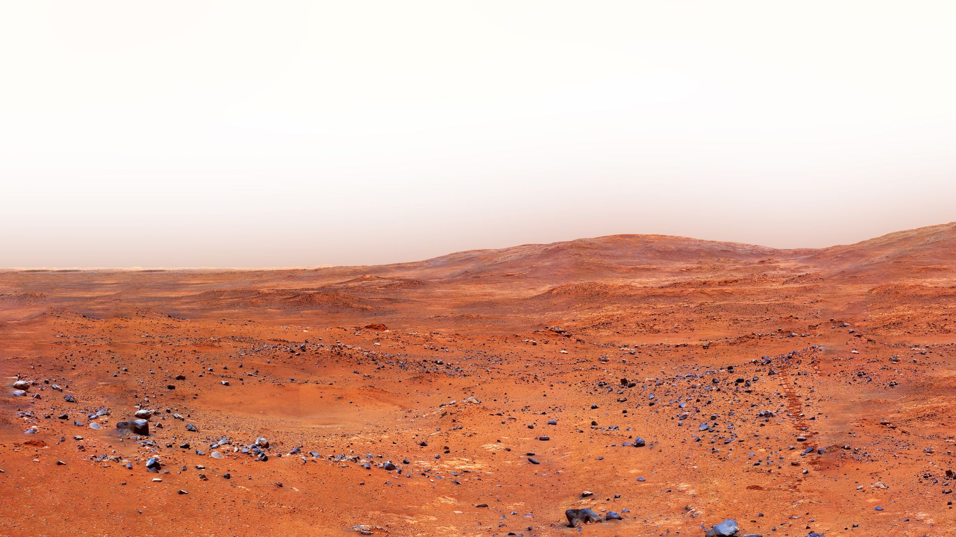 Mars surface showing eroded rocks and dusty terrain
